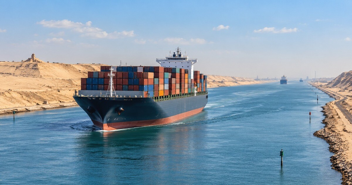 Container ship transiting the Suez Canal with stacked cargo containers
